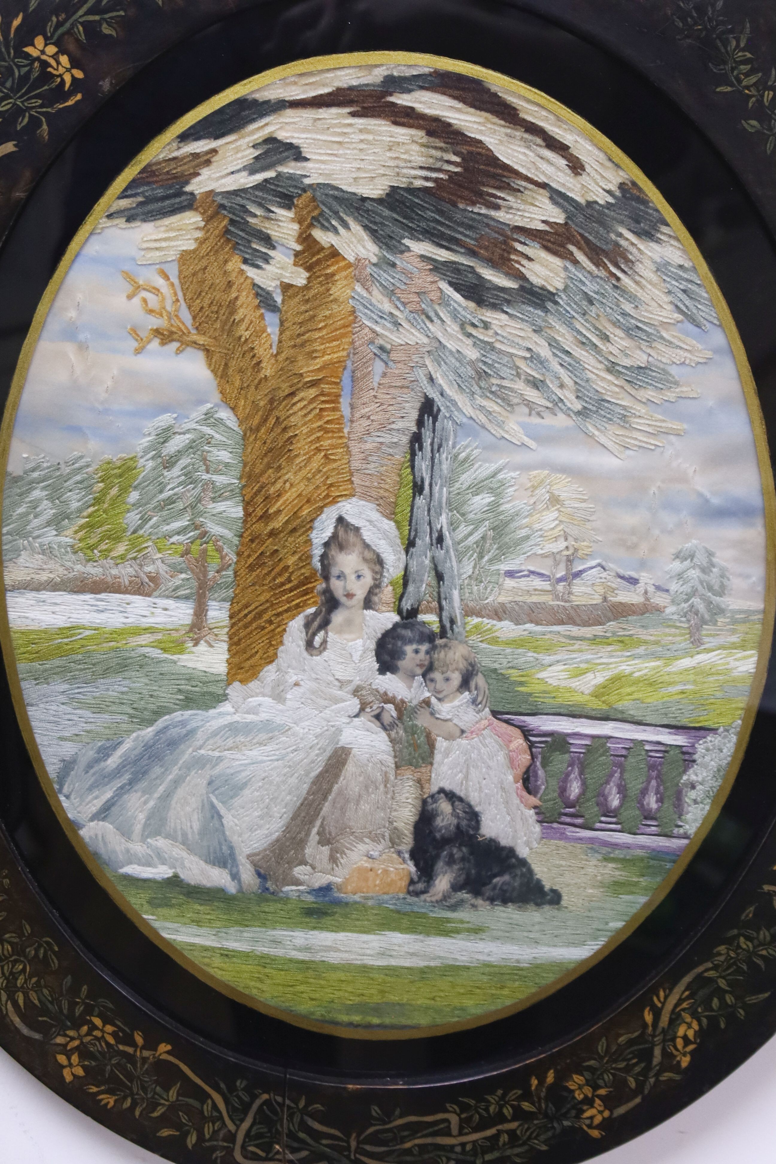 A framed oval Regency silk panel. 40cm long excl frame